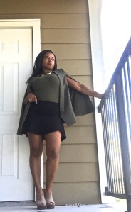 olive cape blazer black mini skirt tan booties gold necklace