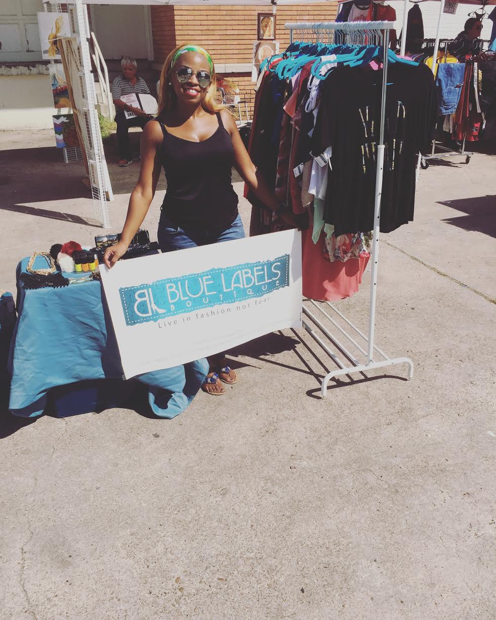 pic of BLB owner holding sign at vendor show