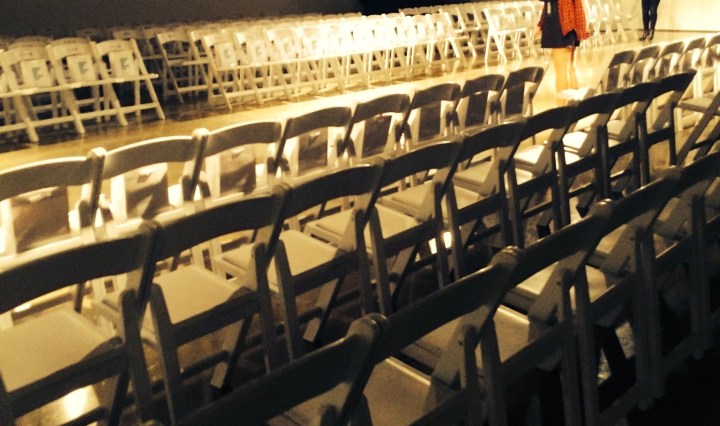 pic of empty runway with white chairs