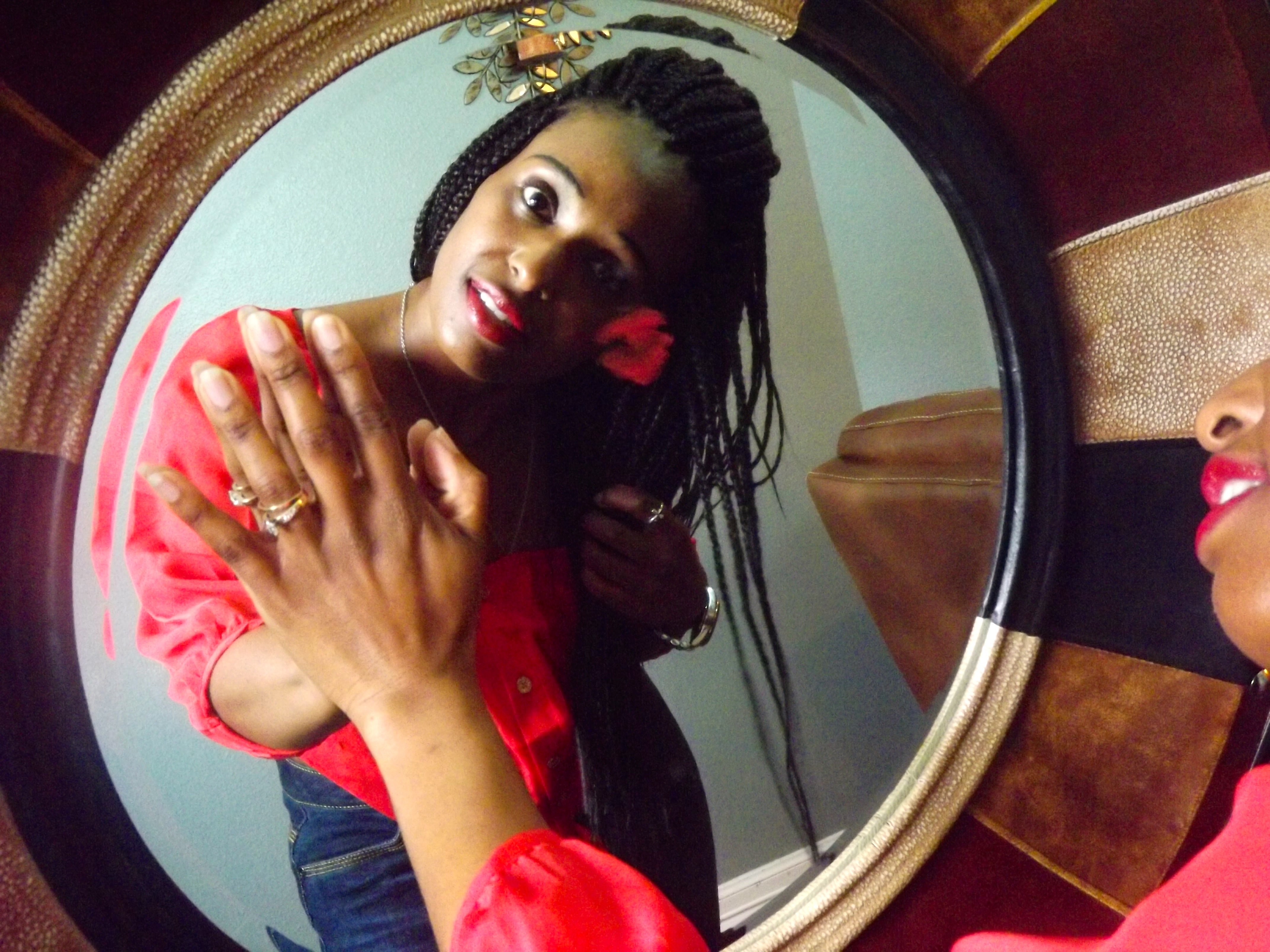 black women kissing herself in the mirror