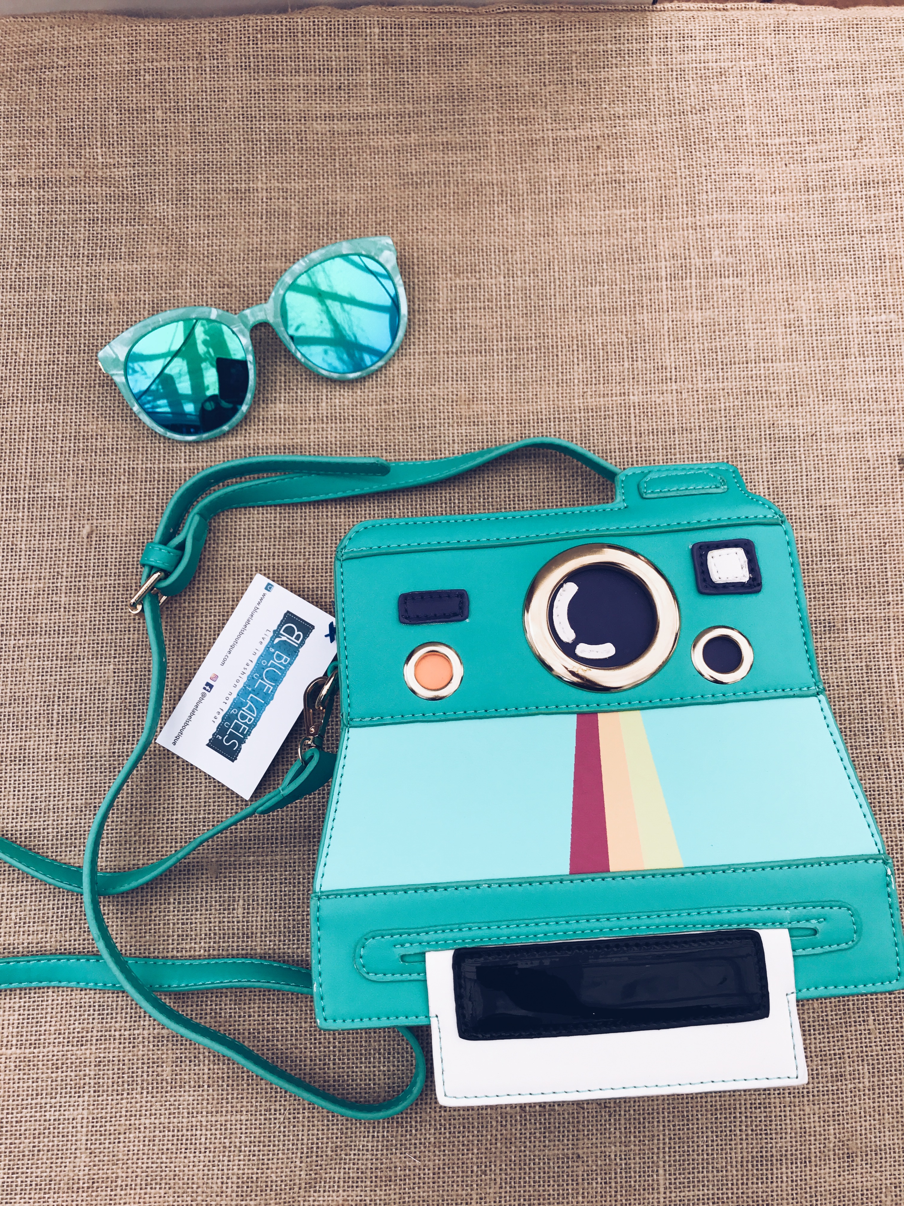 camera bag and sunglasses blue labels boutique