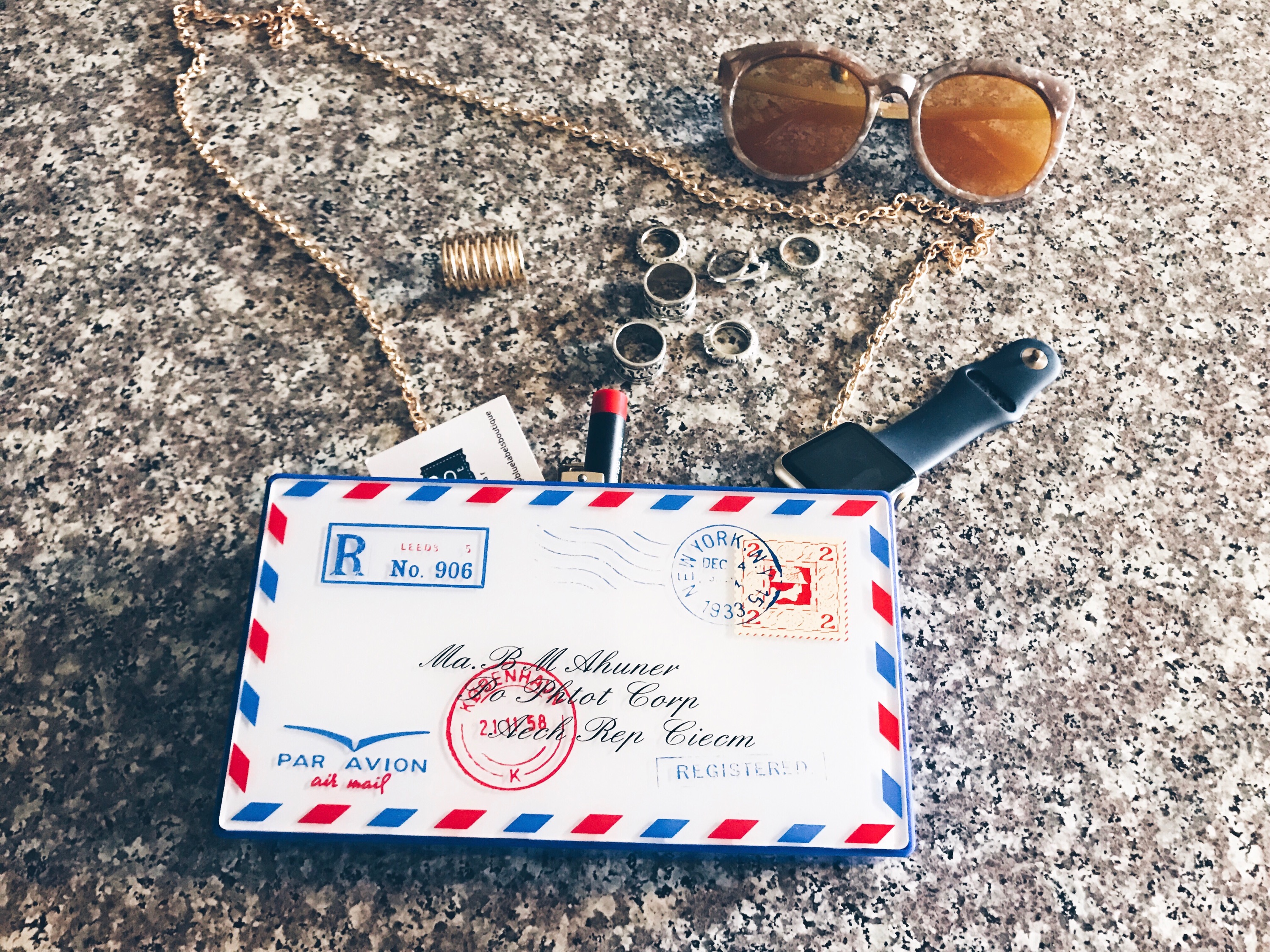 postcard clutch blue labels boutique