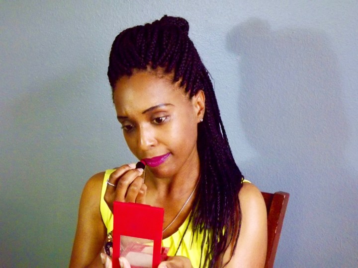 blackwomanapplyinglipstick