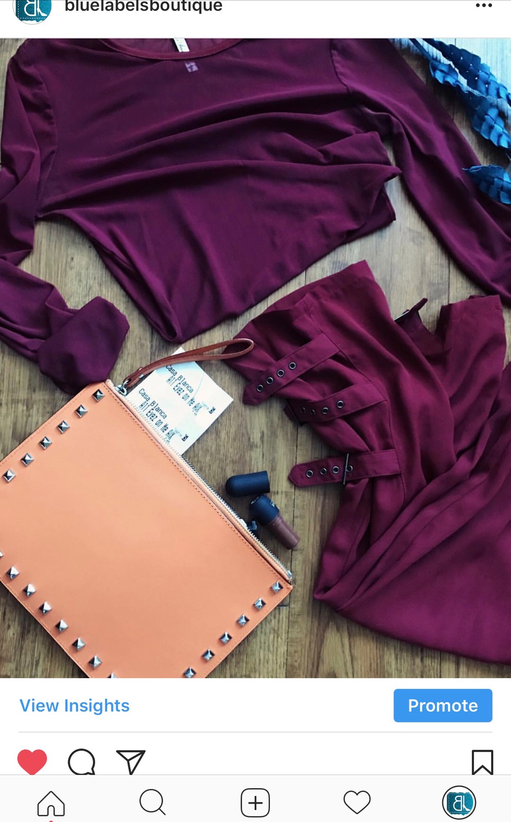 burgundy top, burgundy pants, orange clutch, blue labels boutique