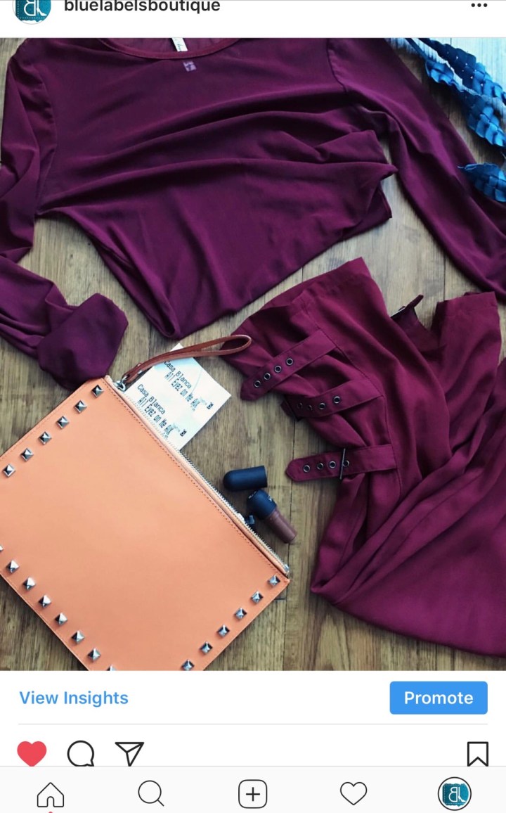 burgundy top, burgundy pants, orange clutch, blue labels boutique