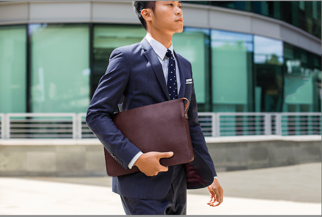 man carrying Issara briefcase
