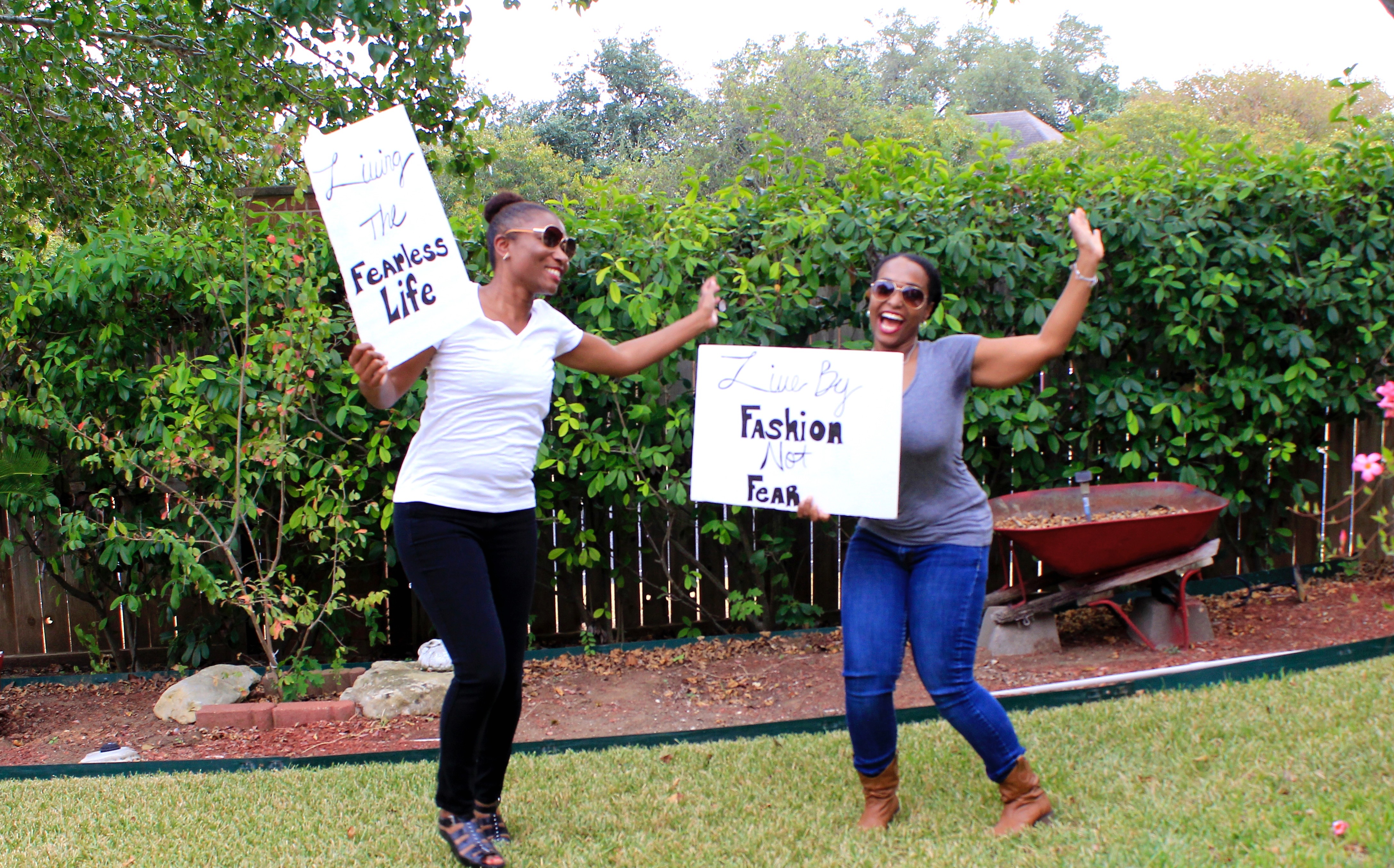 bue labels boutique girls holding signs