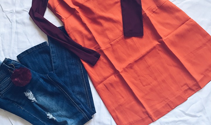 sheer top with vest dress and jeans