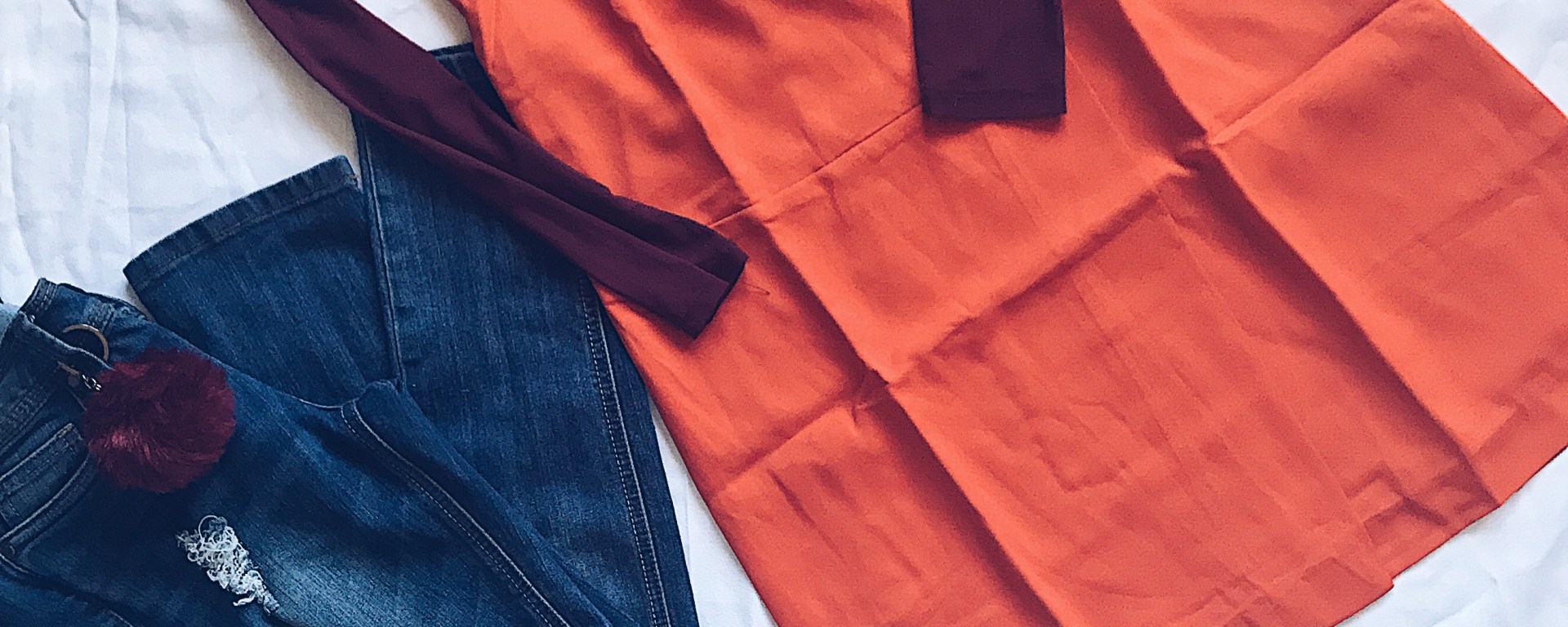 sheer top with vest dress and jeans