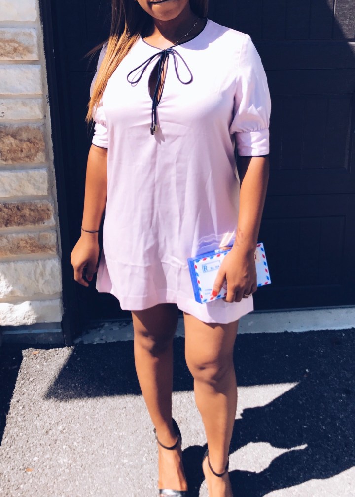 pink satin shift dress with postal clutch