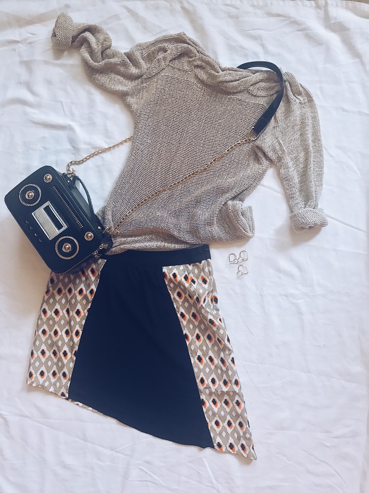 sweater with mini skirt and radio handbag
