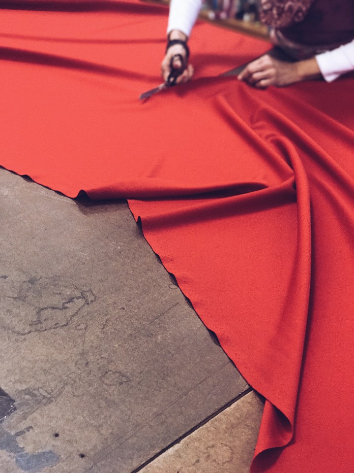 cutting red fabric