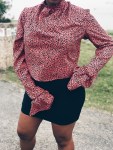 woman wearing pink black animal print blouse