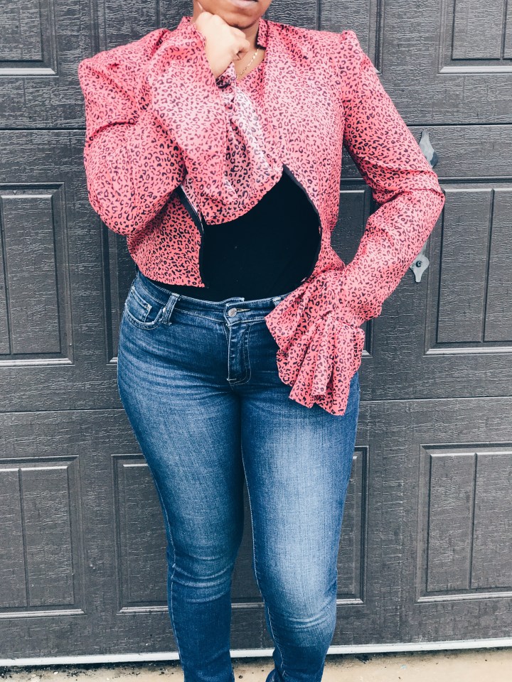 woman wearing pink black animal print blouse openfront