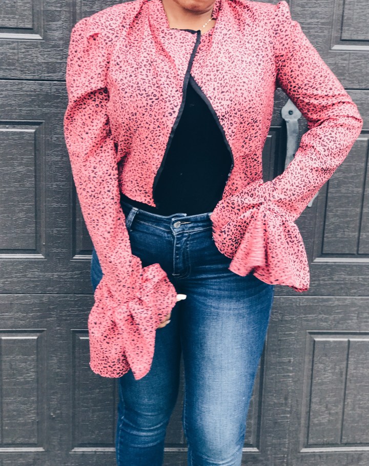 woman wearing pink black animal print blouse open front