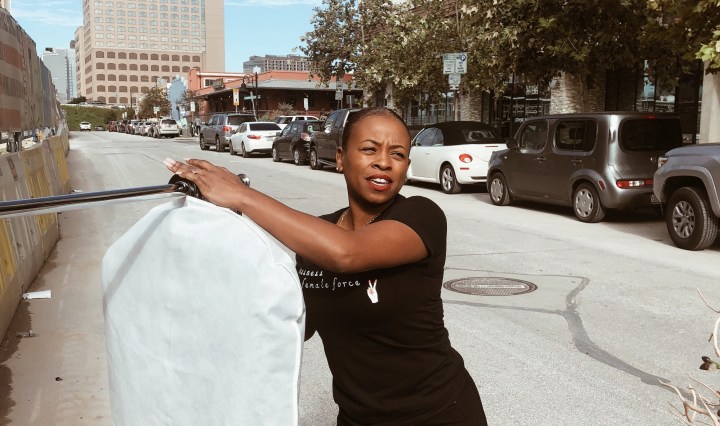 hanging clothes on rack outside