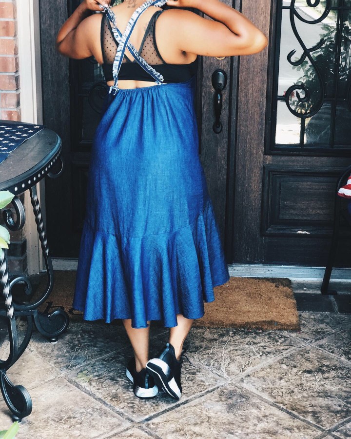 Back of denim dress with Frayed sleeves